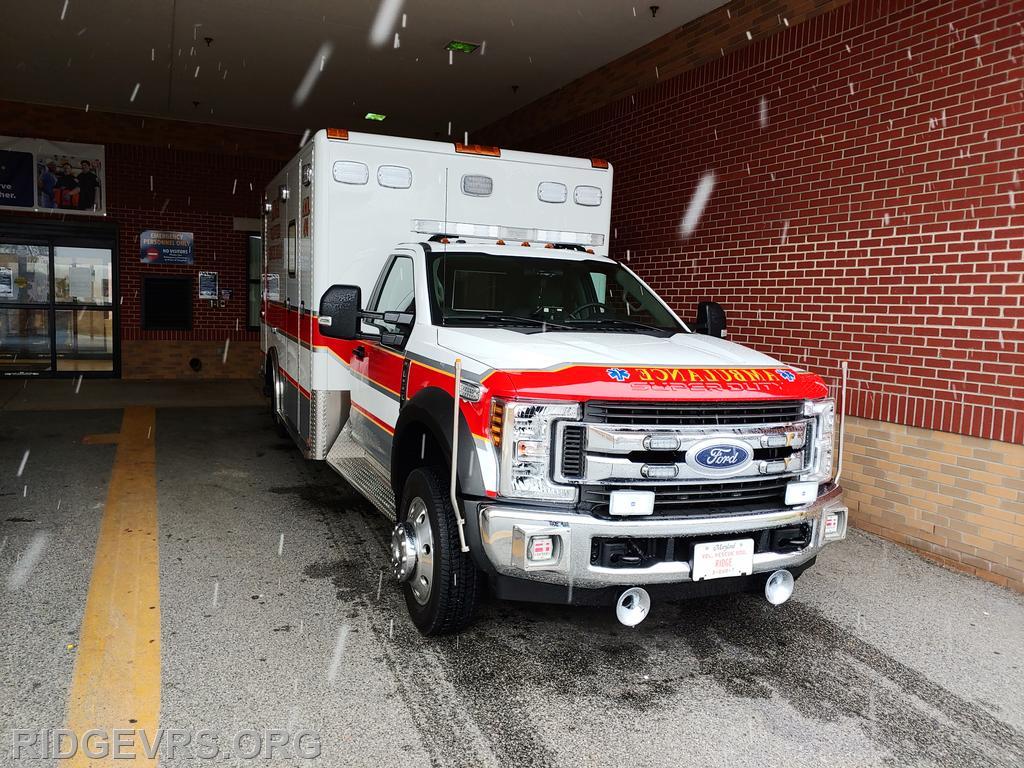 Ambulance 498 out at St. Mary's Hospital as snow starts to fall.